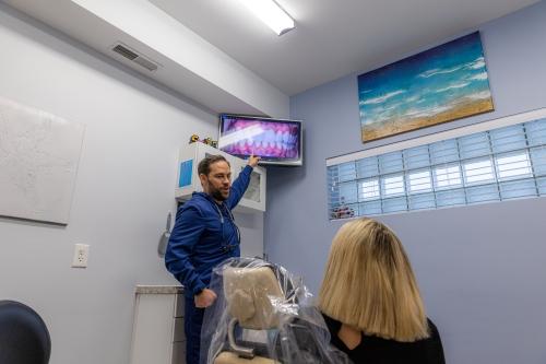 our dentist pointing at the monitor