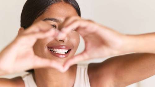 Woman making heart shape